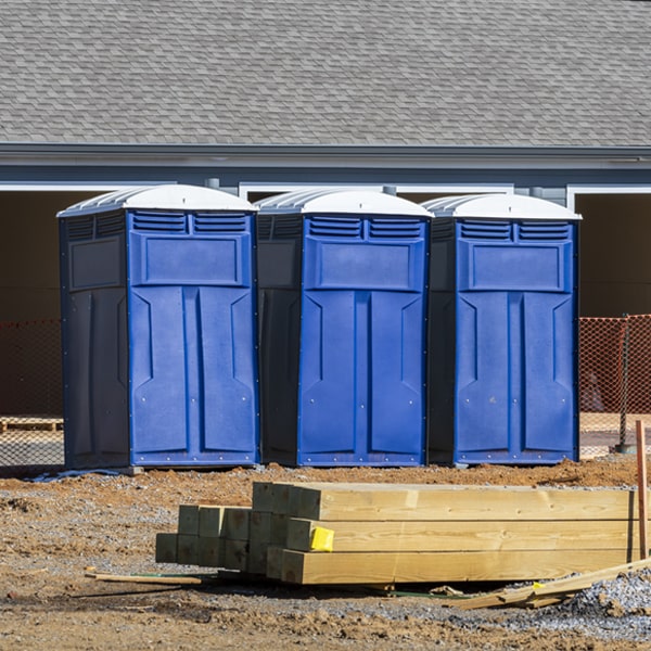 what is the cost difference between standard and deluxe portable toilet rentals in Almont MI